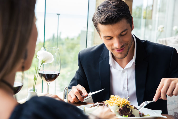 Man and woman sharing pleasant meal