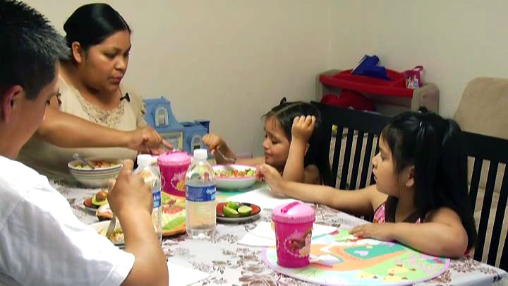 Preschooler and toddler at pleasant family meal