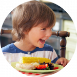 happy boy at meal