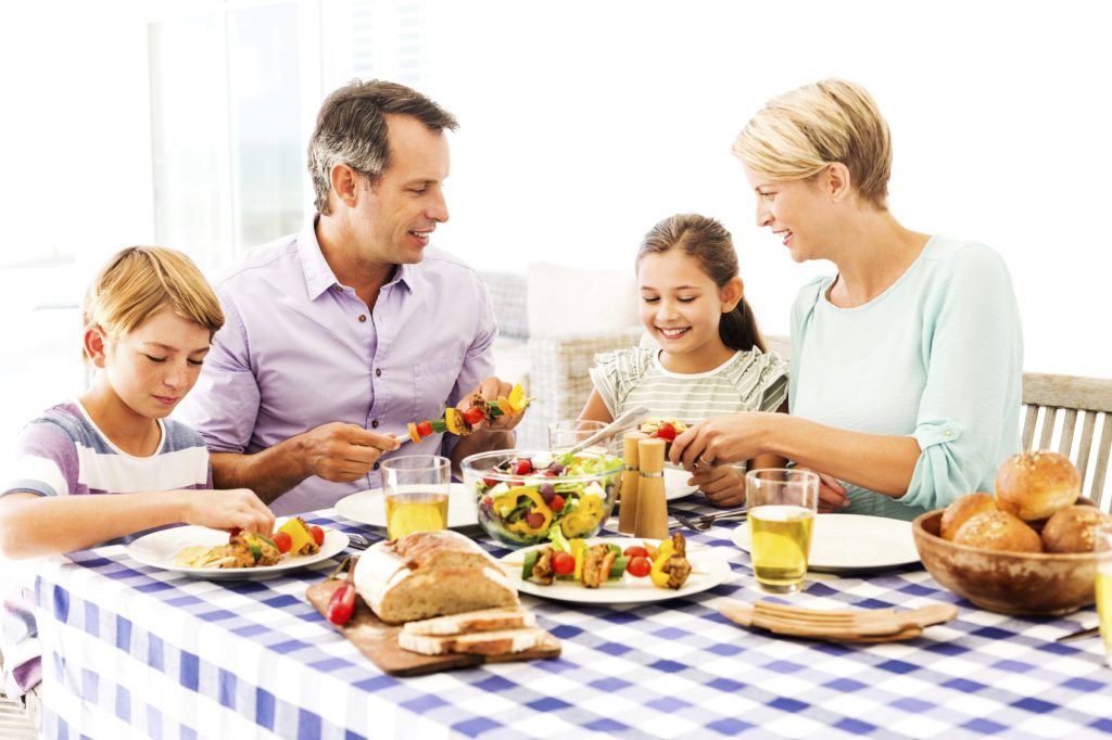 Parents And Children Enjoying Meal At Dining Table Ellyn Satter Institute